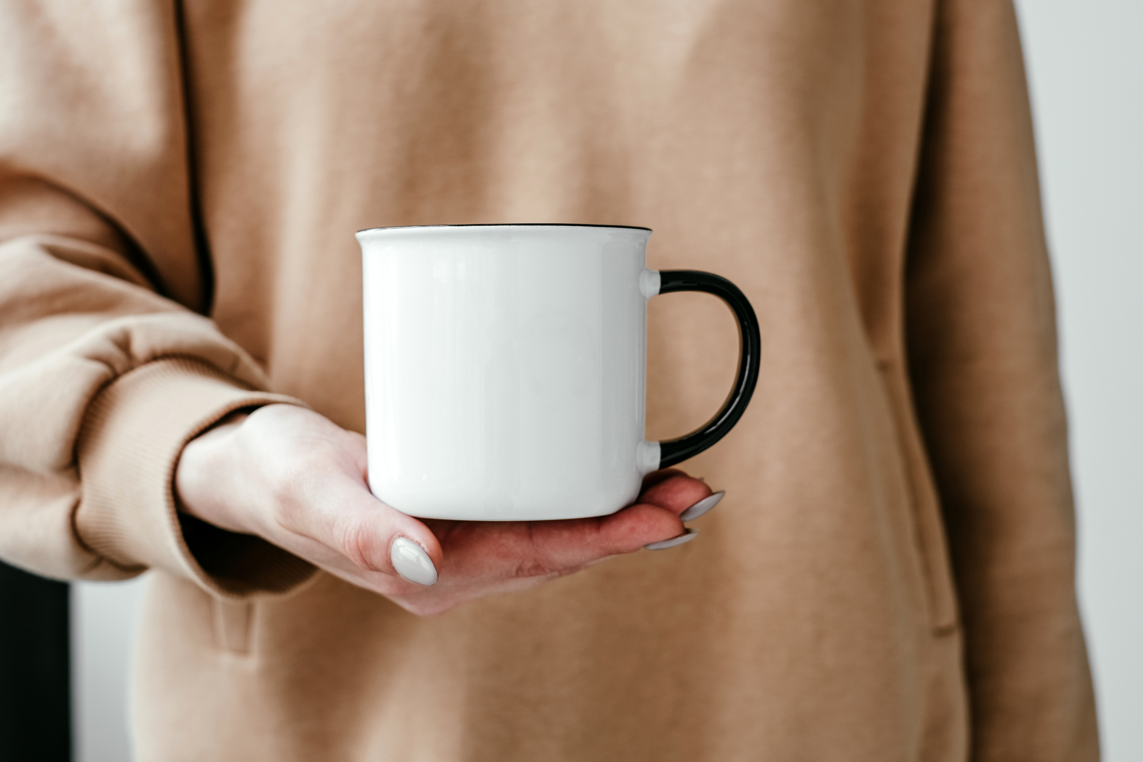 A Person Holding a Ceramic Mug